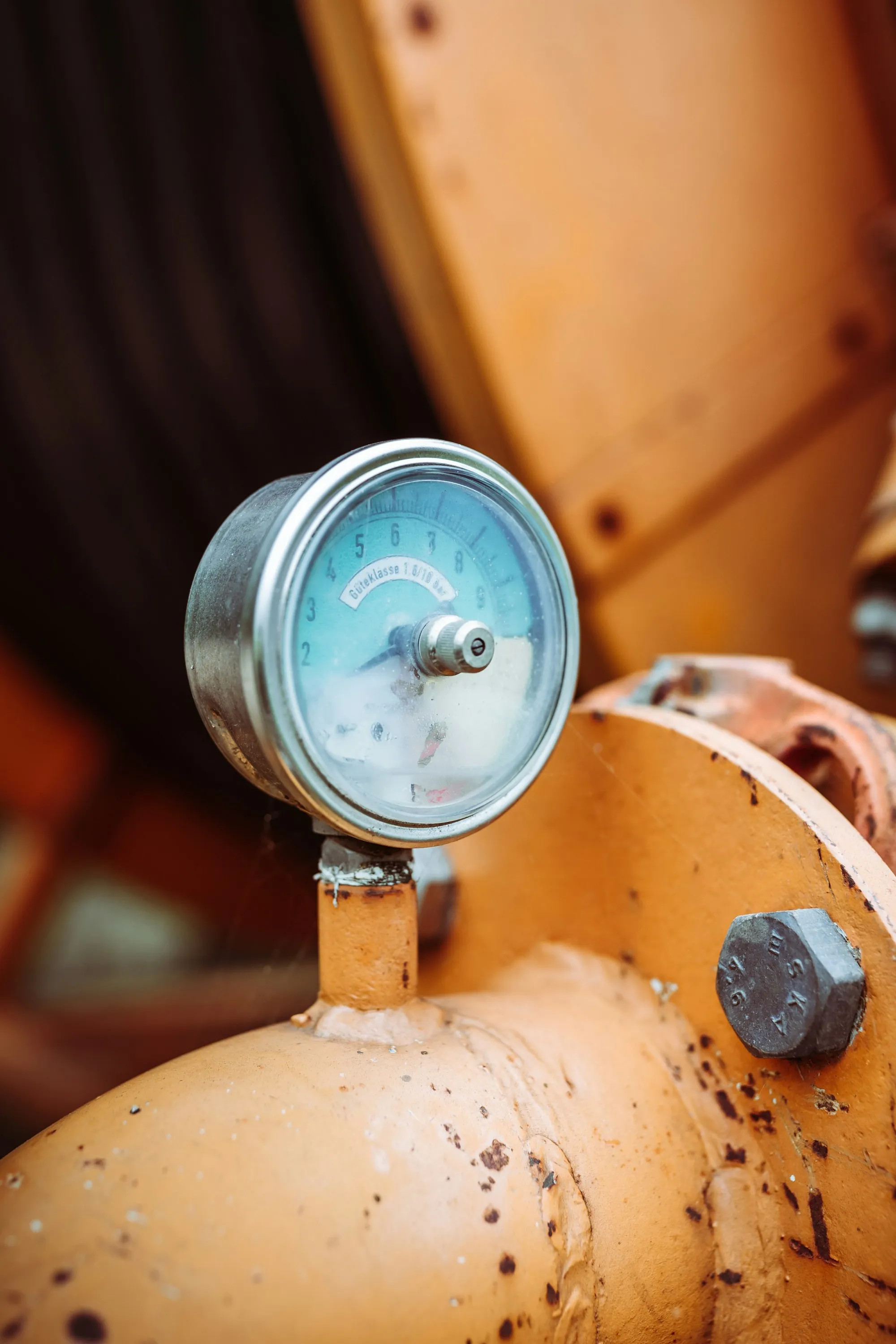 Pressure gauge with a blue face on a fitting